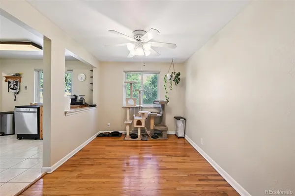 a view of a livingroom with furniture window and wooden floor