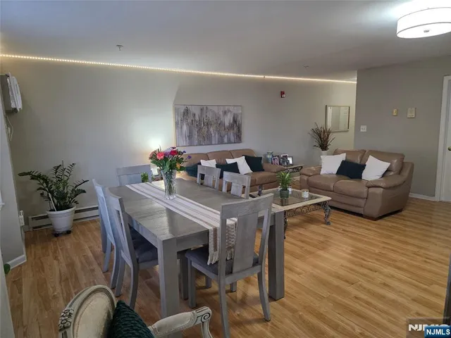a dining room with a table and chairs