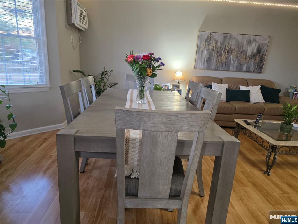420 Passaic Street, Unit 2G Hackensack, NJ 07601 - Photo 15 of 35 a dining room with furniture and wooden floor