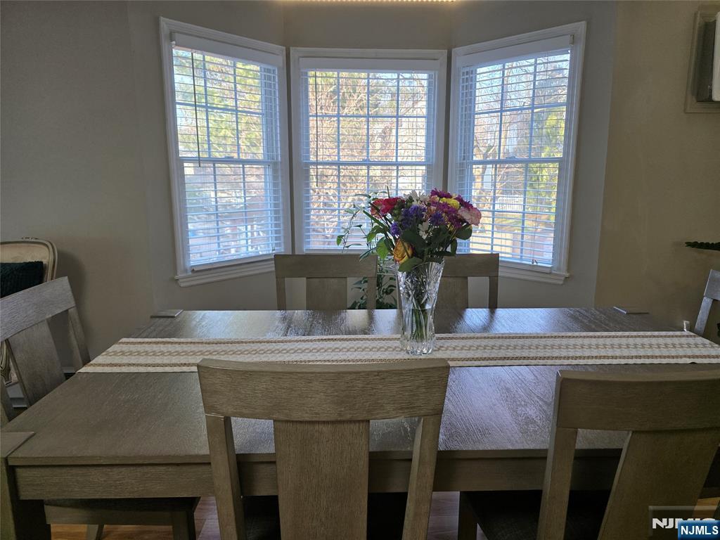420 Passaic Street, Unit 2G Hackensack, NJ 07601 - Photo 17 of 35 a dining room with a table and chairs