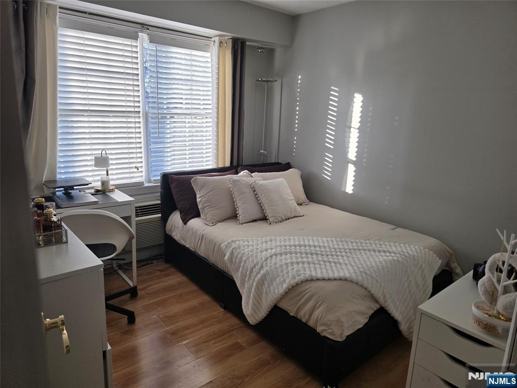 420 Passaic Street, Unit 2G Hackensack, NJ 07601 - Photo 29 of 35 a bedroom with a bed chair and windows