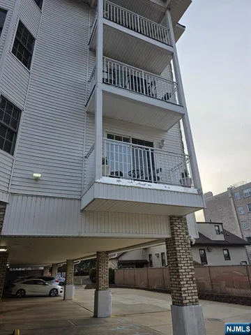 a living room with fireplace furniture and a window