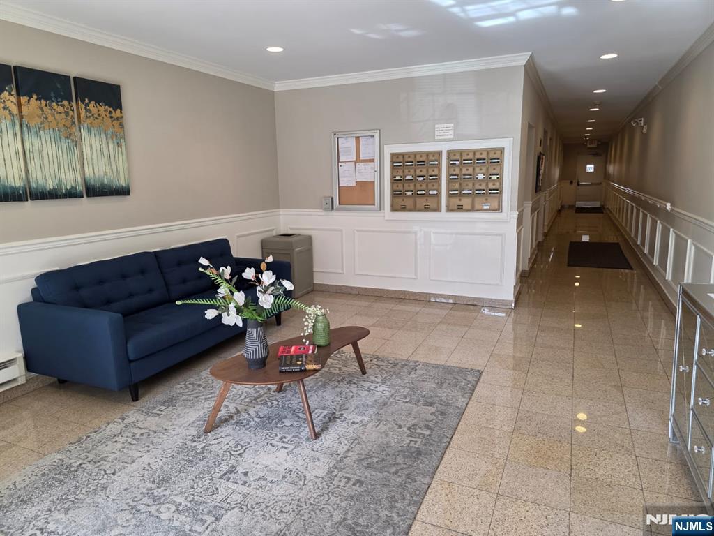 420 Passaic Street, Unit 2G Hackensack, NJ 07601 - Photo 5 of 35 a living room with furniture and a potted plant