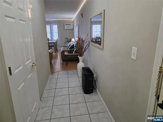 a view of a livingroom with furniture and a potted plant