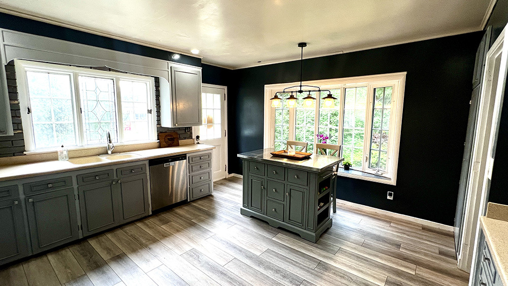 644 Genesee Avenue Morrison, IL 61270 - Photo 13 of 52 a large kitchen with kitchen island a large window a sink and stainless steel appliances