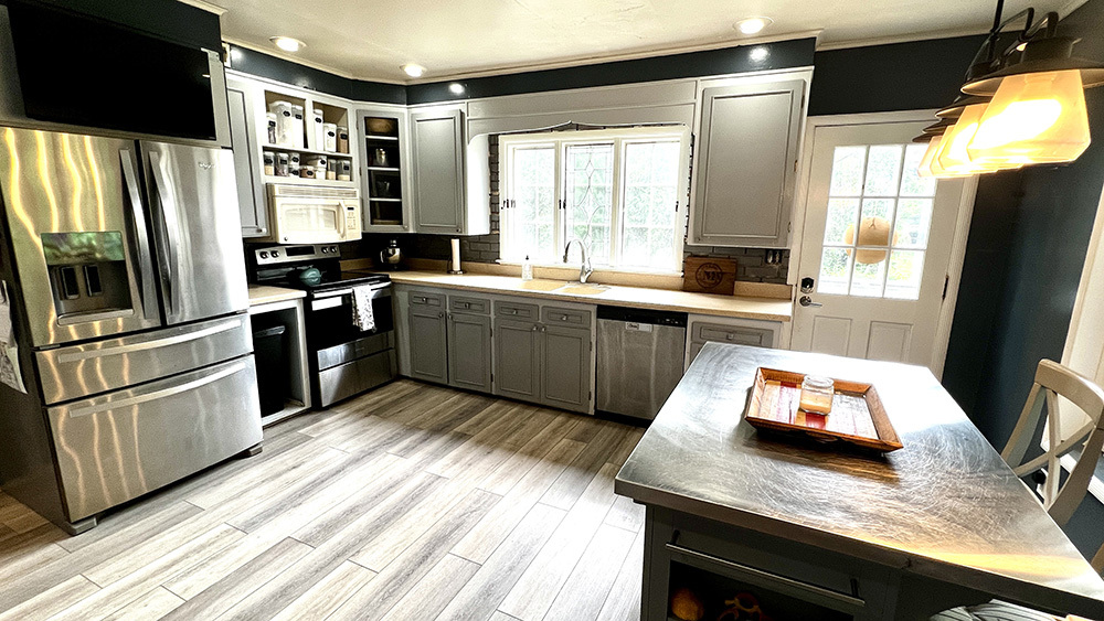 644 Genesee Avenue Morrison, IL 61270 - Photo 15 of 52 a kitchen with stainless steel appliances granite countertop a sink stove and refrigerator