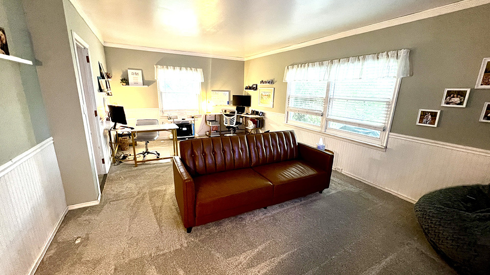 644 Genesee Avenue Morrison, IL 61270 - Photo 18 of 52 a living room with furniture and a large window