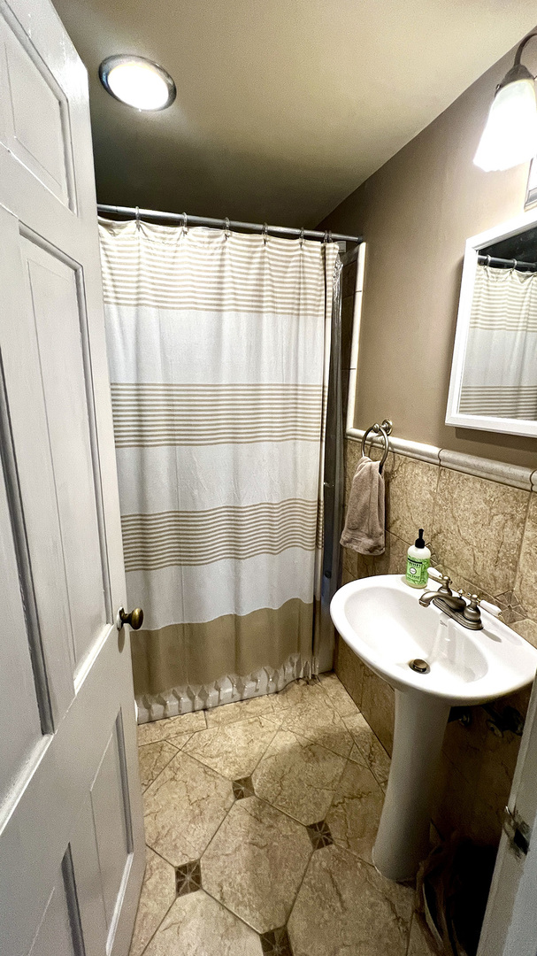 644 Genesee Avenue Morrison, IL 61270 - Photo 20 of 52 a bathroom with a sink and a mirror