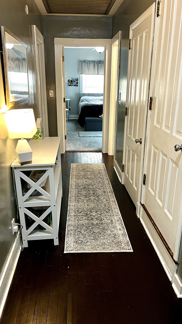 644 Genesee Avenue Morrison, IL 61270 - Photo 25 of 52 a view of a hallway with wooden floor and furniture