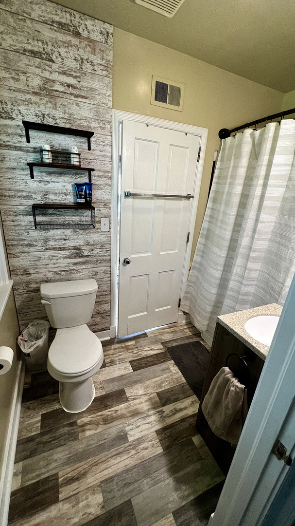 644 Genesee Avenue Morrison, IL 61270 - Photo 32 of 52 a bathroom with a toilet and a shower