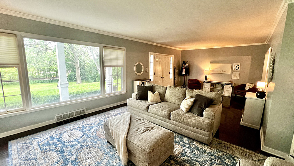 644 Genesee Avenue Morrison, IL 61270 - Photo 9 of 52 a living room with furniture and a large window