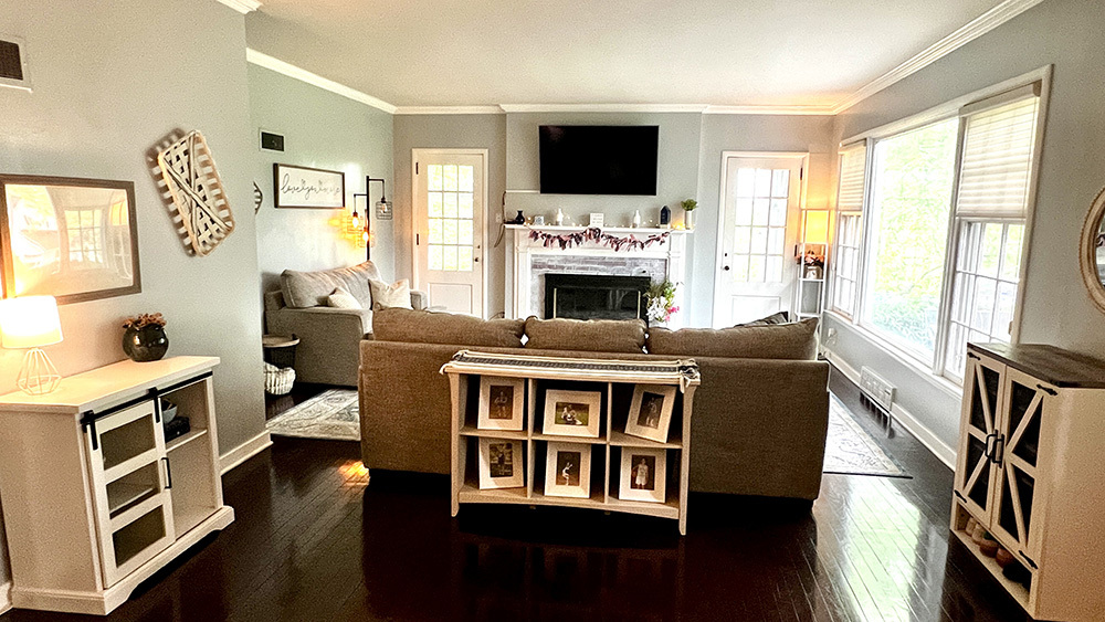 644 Genesee Avenue Morrison, IL 61270 - Photo 10 of 52 a living room with furniture a flat screen tv and a fireplace