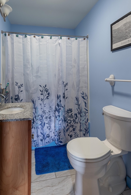 425 Dingle Road Worthington, MA 01098 - Photo 13 of 32 a bathroom with a granite countertop toilet and a sink