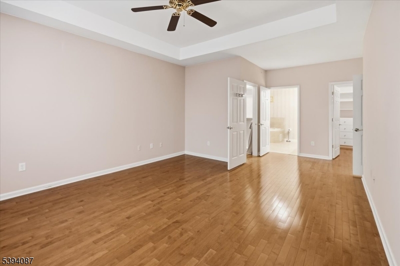 89 Ridgeview Lane, Unit 89 Mount Arlington, NJ 07856 - Photo 20 of 43 a view of empty room with wooden floor