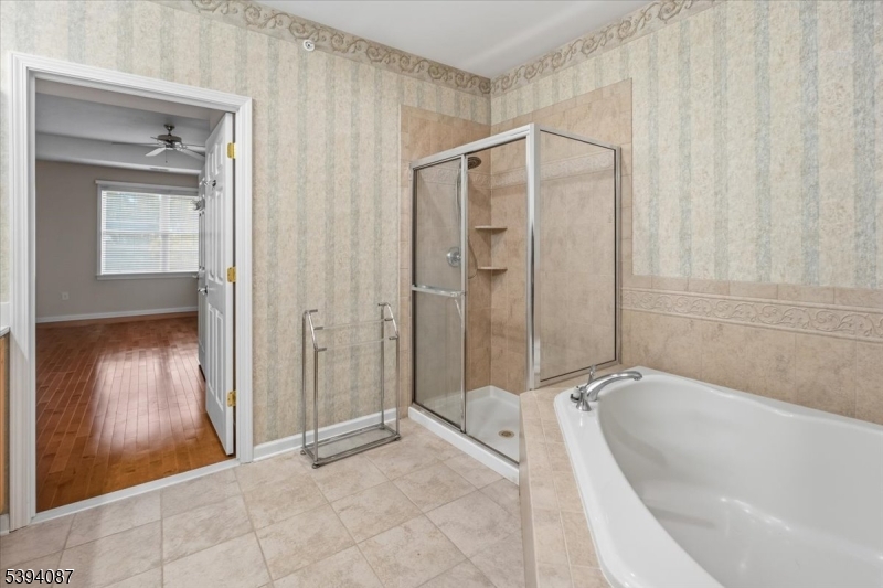 89 Ridgeview Lane, Unit 89 Mount Arlington, NJ 07856 - Photo 23 of 43 a bathroom with a bathtub and a shower
