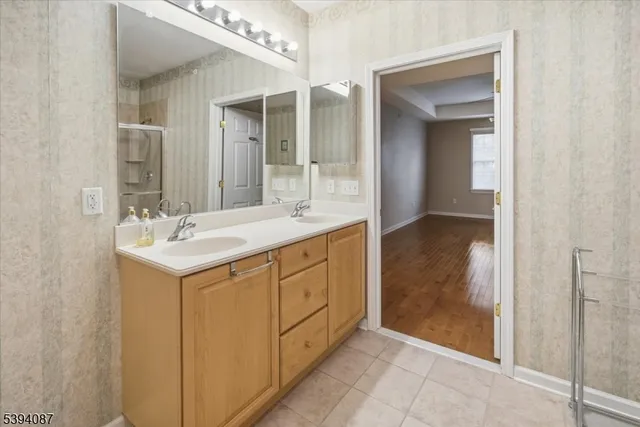 a bathroom with a sink and a mirror