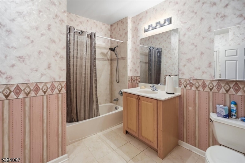 89 Ridgeview Lane, Unit 89 Mount Arlington, NJ 07856 - Photo 28 of 43 a bathroom with a sink toilet and shower
