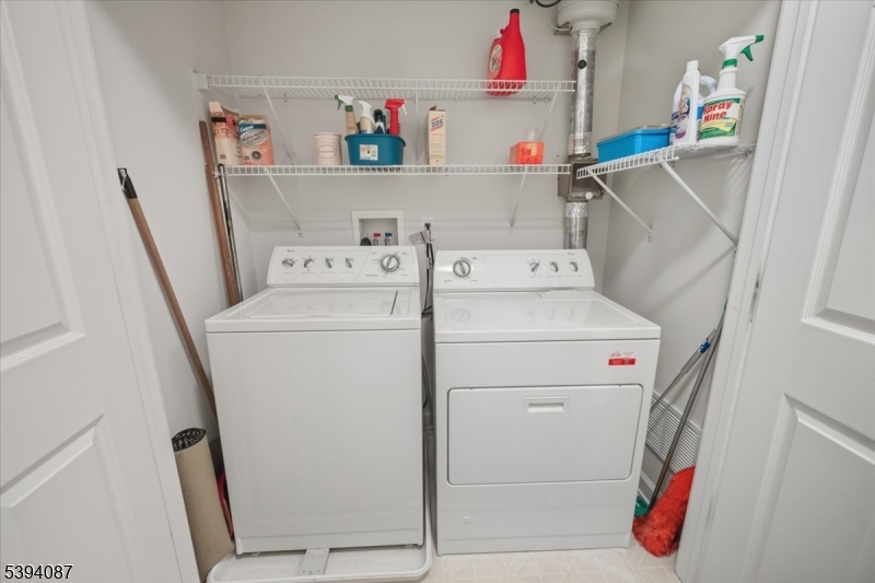 89 Ridgeview Lane, Unit 89 Mount Arlington, NJ 07856 - Photo 30 of 43 a utility room with dryer and washer