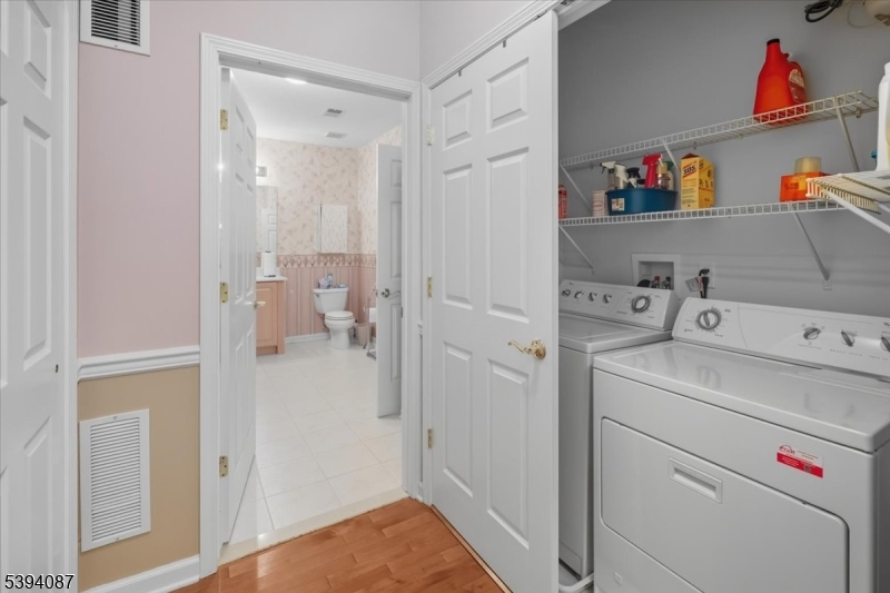 89 Ridgeview Lane, Unit 89 Mount Arlington, NJ 07856 - Photo 31 of 43 a utility room with dryer and washer