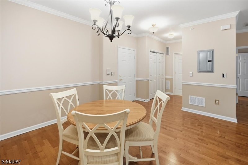 89 Ridgeview Lane, Unit 89 Mount Arlington, NJ 07856 - Photo 5 of 43 a view of a dining room with furniture and wooden floor