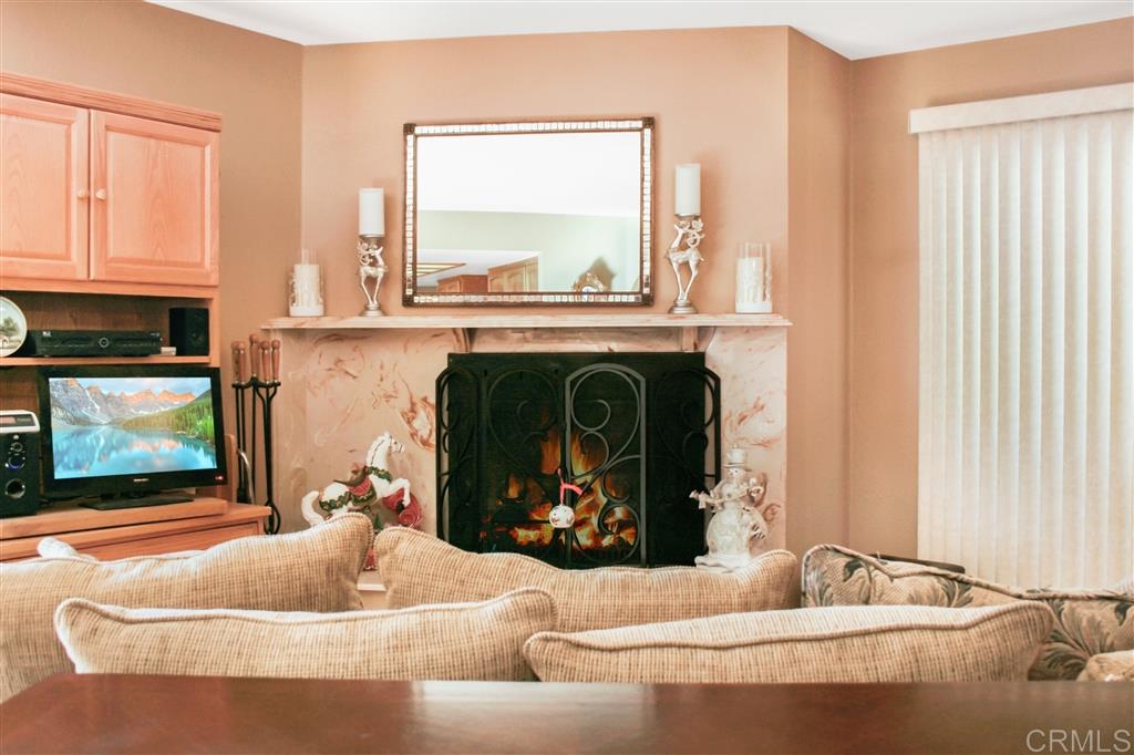 14705 Vesper Road Valley Center, CA 92082 - Photo 15 of 25 Cozy family room fireplace