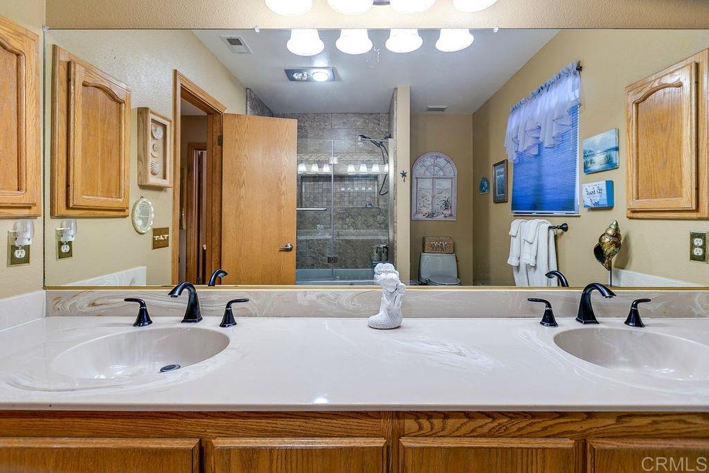 14705 Vesper Road Valley Center, CA 92082 - Photo 17 of 25 Guest bath with dual sinks