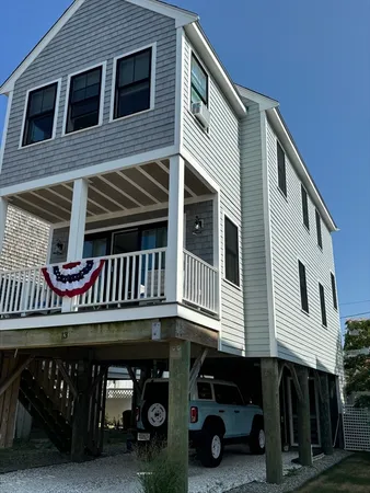 a view of a house with large windows
