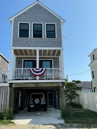 a view of house with outdoor space and parking