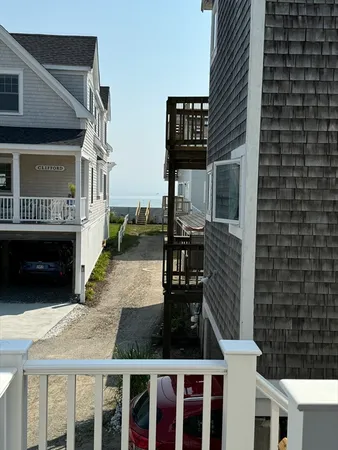 a view of a house with backyard and deck