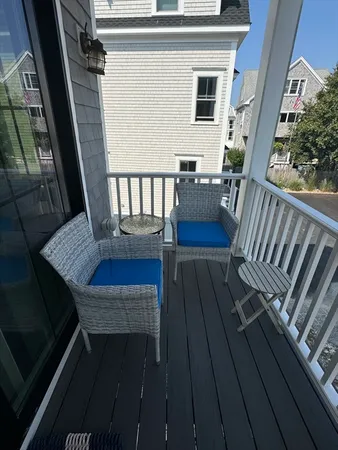 a view of balcony with wooden floor
