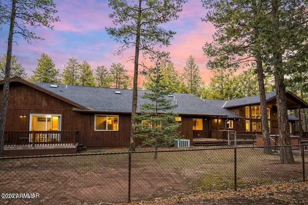 a house with trees in front of it