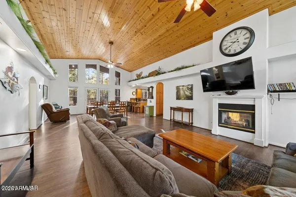 a bedroom with furniture and a fireplace