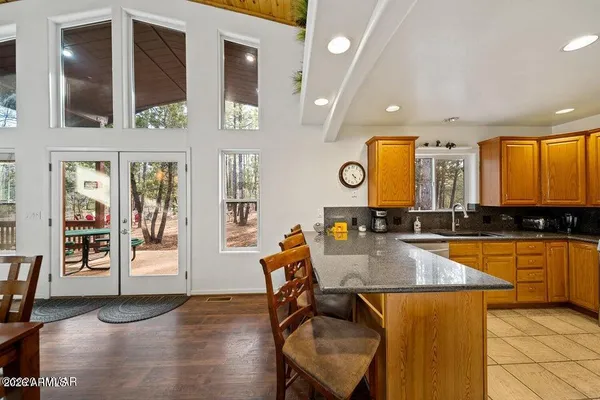 a kitchen with stainless steel appliances kitchen island granite countertop lots of counter top space