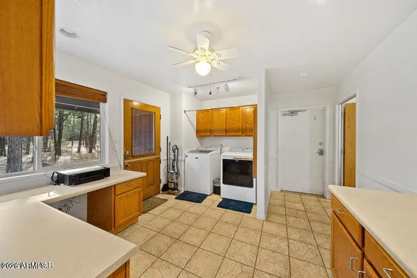 a kitchen with a sink a stove and cabinets