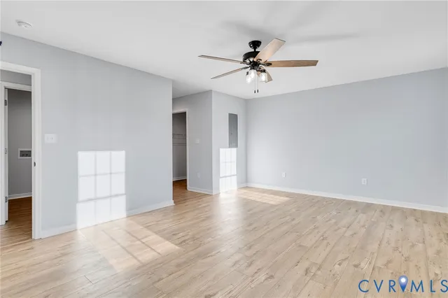 wooden floor in an empty room with a window
