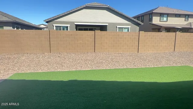 a view of a house with a yard and garage