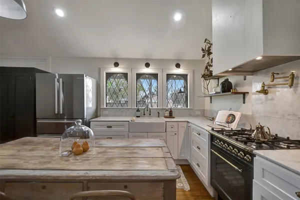 a kitchen with a stove and a refrigerator