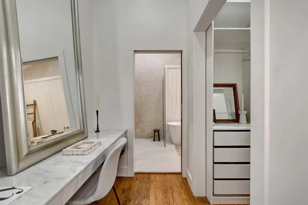 a view of bathroom with a tub and mirror