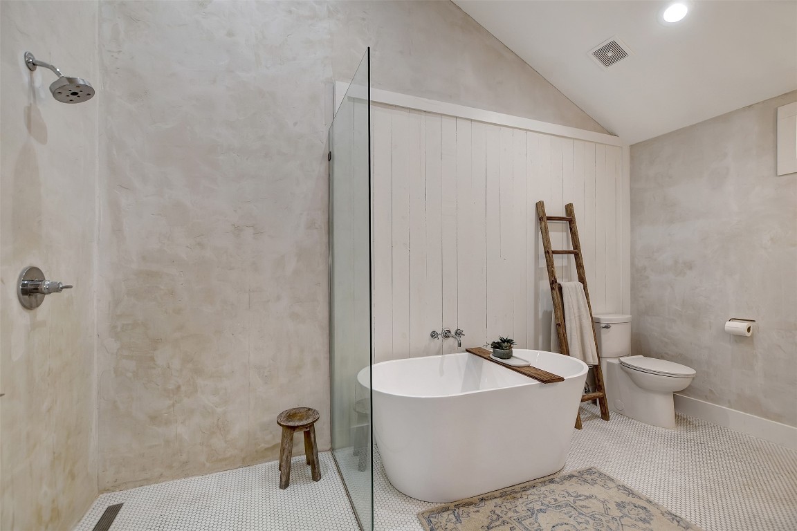 507 Mason Street Tomball, TX 77375 - Photo 15 of 24 a bathroom with a sink a toilet and a tub