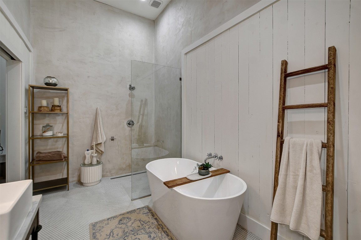 507 Mason Street Tomball, TX 77375 - Photo 17 of 24 a bathroom with a toilet a sink and mirror
