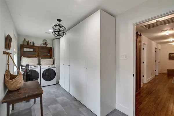 a view of a utility room with dryer and washer