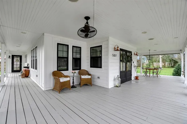 a view of a livingroom with furniture window and wooden floor