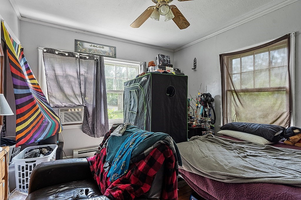 55 Sylvan Road Lancaster, MA 01523 - Photo 12 of 22 a bedroom with furniture and a window