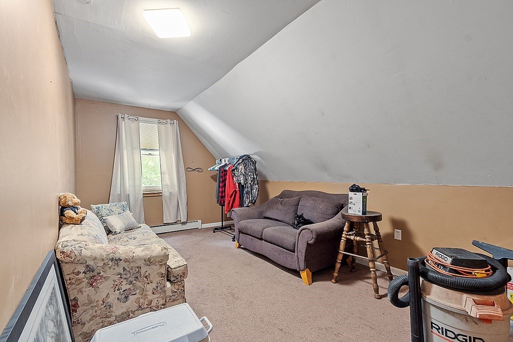 55 Sylvan Road Lancaster, MA 01523 - Photo 16 of 22 a living room with furniture and a window