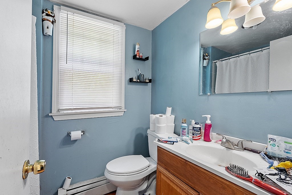 55 Sylvan Road Lancaster, MA 01523 - Photo 19 of 22 a bathroom with a sink toilet and window