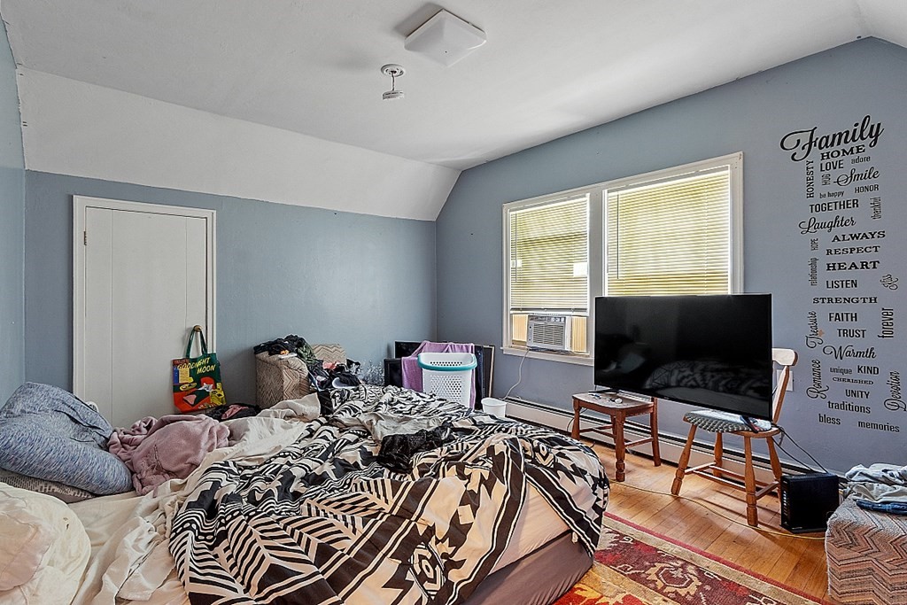 55 Sylvan Road Lancaster, MA 01523 - Photo 20 of 22 a bedroom with two beds and a flat screen tv