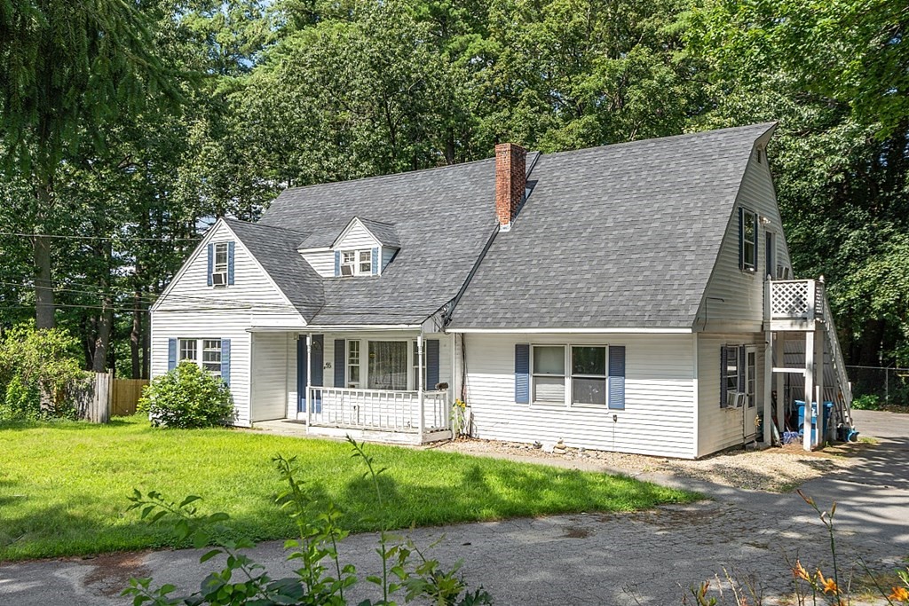 55 Sylvan Road Lancaster, MA 01523 - Photo 2 of 22 a front view of a house with a yard