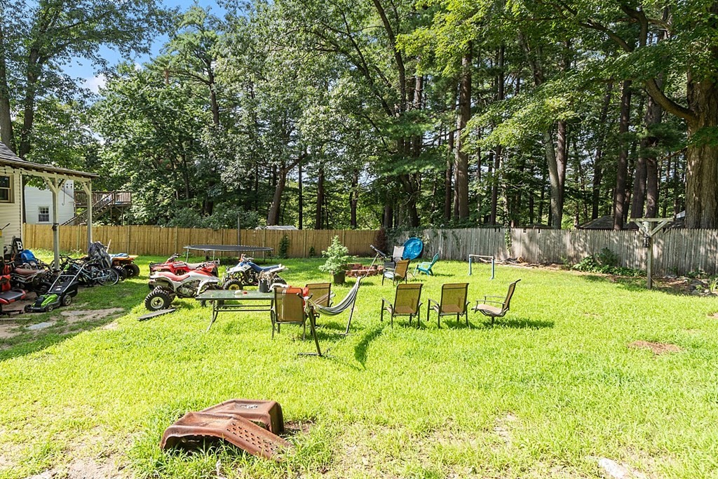55 Sylvan Road Lancaster, MA 01523 - Photo 6 of 22 a view of swimming pool with lawn chairs and a fire pit