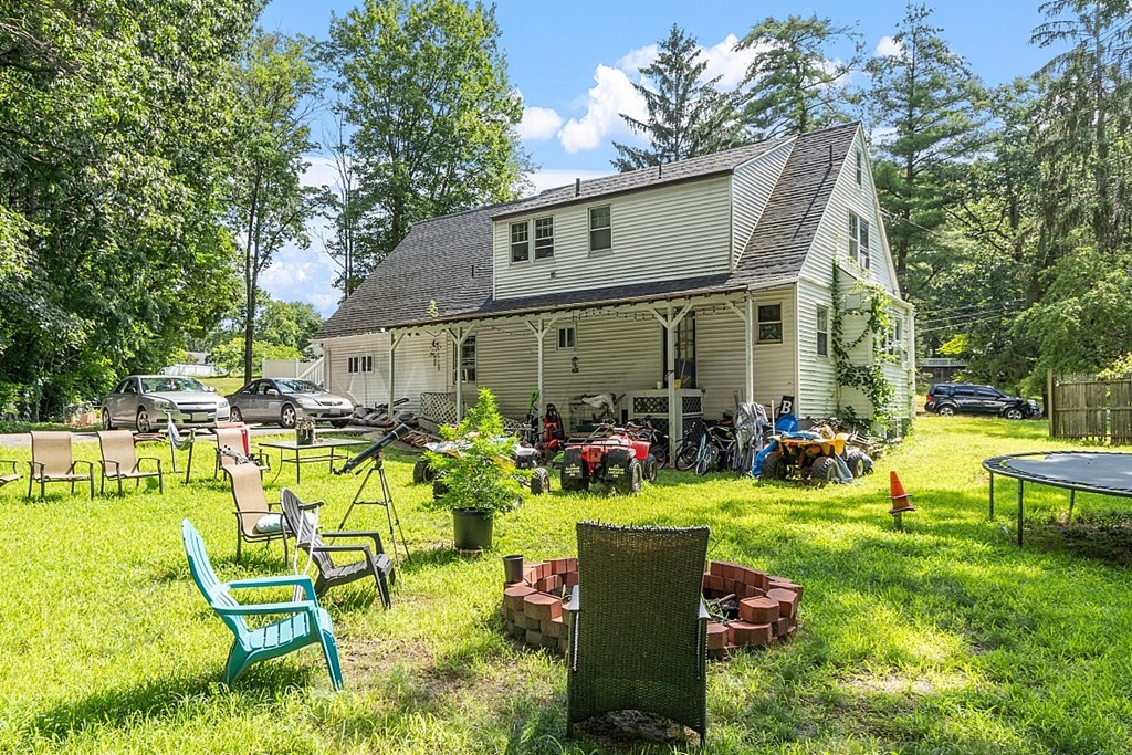 55 Sylvan Road Lancaster, MA 01523 - Photo 7 of 22 a view of a house with swimming pool and sitting area