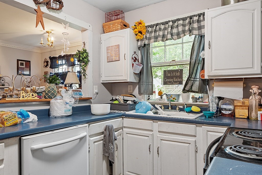 55 Sylvan Road Lancaster, MA 01523 - Photo 8 of 22 a kitchen with a sink a counter and cabinets